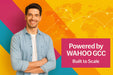 Male model in denim shirt on colorful background with world map and network lines, text reads “Powered by WAHOO GCC – Built to Scale”.