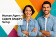 Two people standing against a colorful geometric background with text about Expert Shopify Setup.